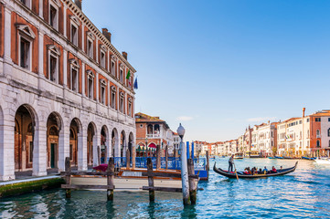 gondola on the Grand Canal and quays of Venice in Veneto, Italy