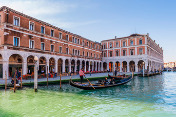 gondola on the Grand Canal and quays of Venice in Veneto, Italy