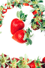 ripe red whole fresh strawberries with green stalks