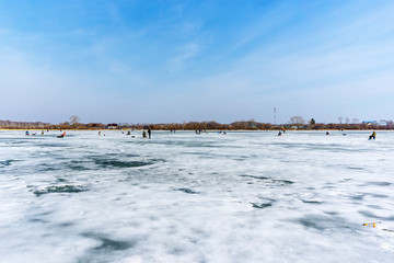 natural winter background, a fisherman on the ice. fishing in the winter, the place for copyspace