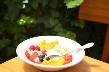 Healthy breakfast or snack curd with fruit and nuts. The concept of nutrition for weight loss. Keto breakfast. Keto lunch idea. cottage cheese or yogurt with berries on a window cup of coffee or tea