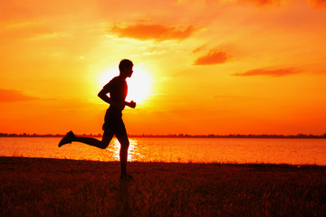 Athlete runner feet running on road, Jogging at outdoors. Man running for exercise.Sports and healthy lifestyle concept.