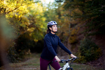 Woman riding a mountain bike outdoor in nature