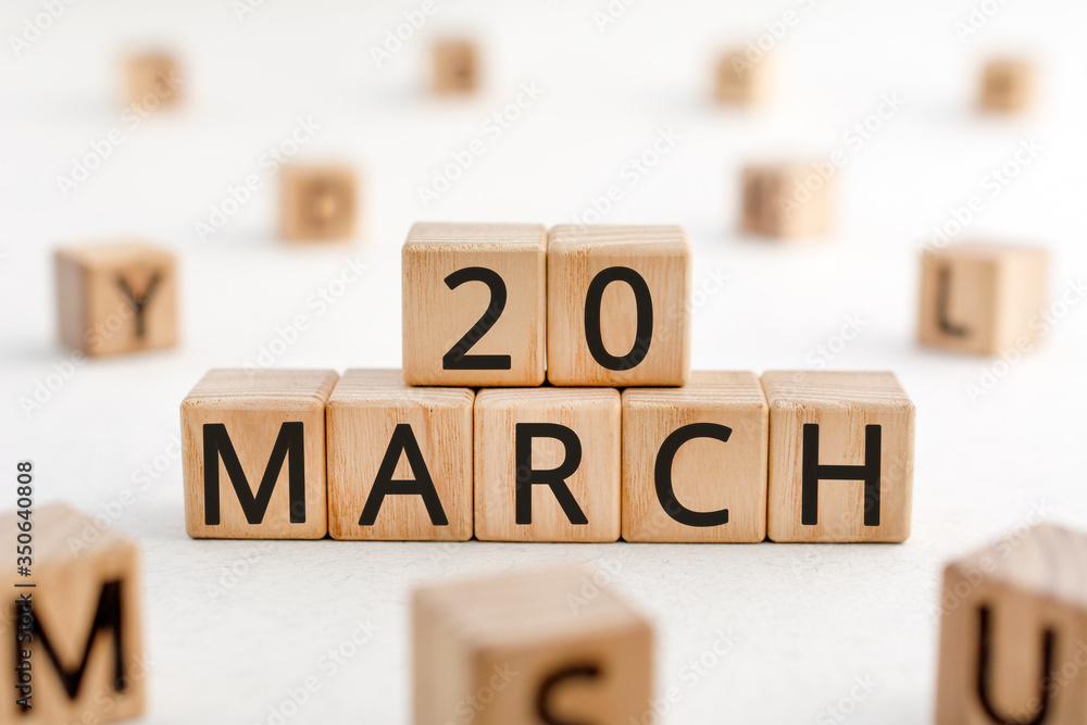 Poster march 20 - from wooden blocks with letters, important date concept, white background random letters 