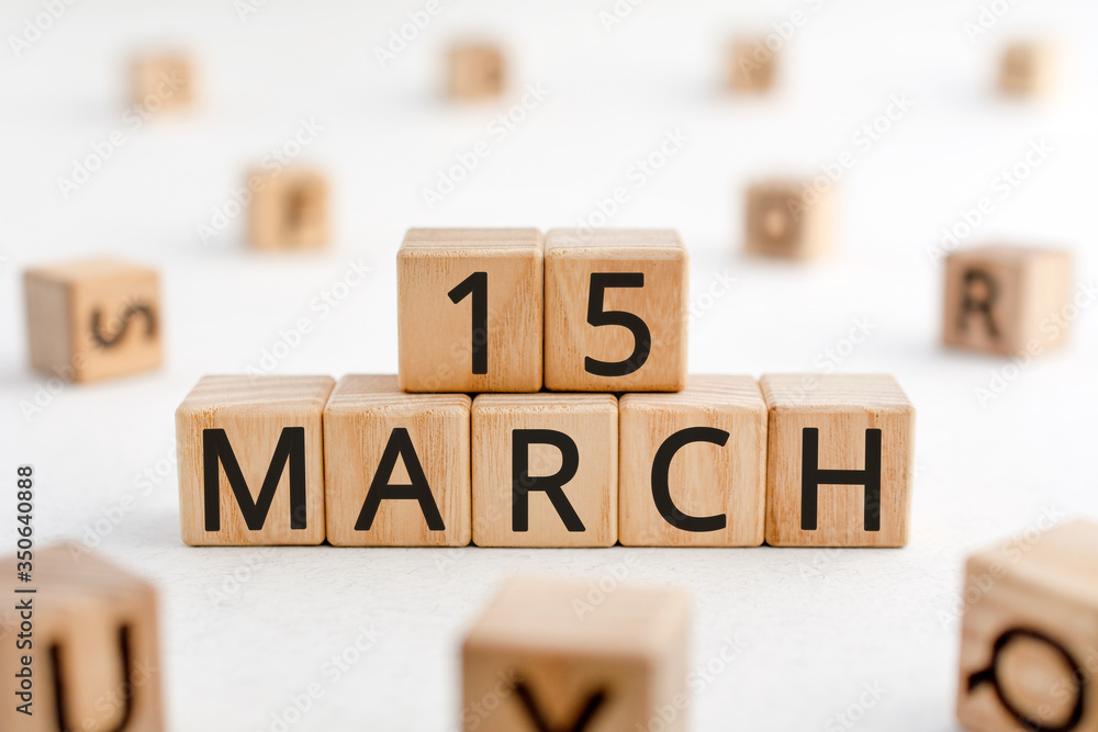 Poster march 15 - from wooden blocks with letters, important date concept, white background random letters 