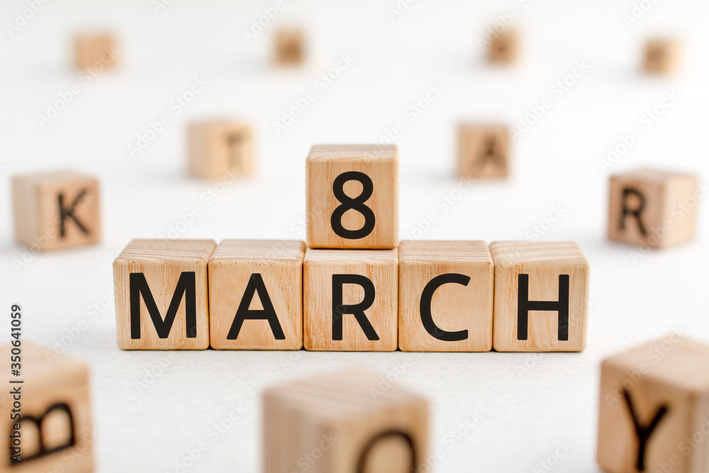 Poster march 8 - from wooden blocks with letters, important date concept, white background random letters a