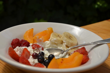 Healthy breakfast or snack curd with fruit and nuts. The concept of nutrition for weight loss. Keto breakfast. Keto lunch idea. cottage cheese or yogurt with berries on a window cup of coffee or tea