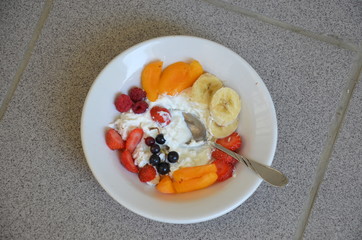 Healthy breakfast or snack curd with fruit and nuts. The concept of nutrition for weight loss. Keto breakfast. Keto lunch idea. cottage cheese or yogurt with berries on a window cup of coffee or tea