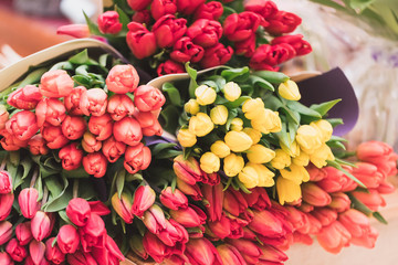 Bouquets of tulips on the counter of the florist store. Flower business