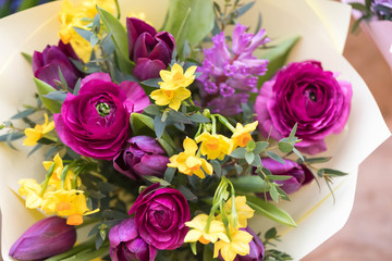 A big holiday bouquet in yellow tones. Narcissists, hyacinths, ranunculus and eucalyptus branches