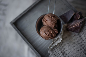 chocolate ice cream balls on wooden background