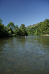 Fototapeta na wymiar fly trout fisherman in big river