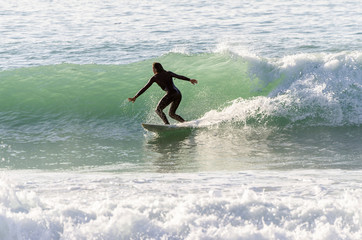 Surfer riding the waves of the sea