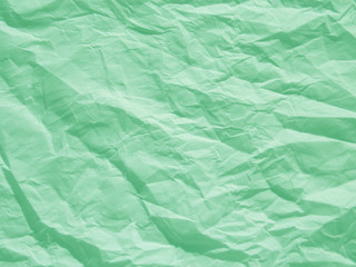 Mint green crumpled paper texture background
