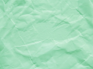 Mint green crumpled paper texture background