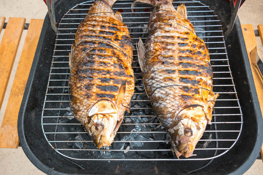 Fish on the grill with vertical orientation. Roast bocachico
