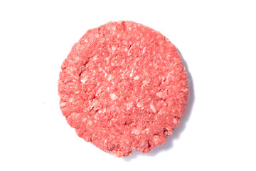 Fresh raw beef burger on a white surface. Top view.