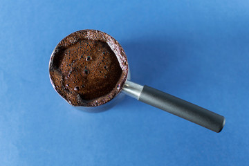 Aromatic coffee made at home on a bright blue background