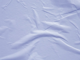 Light blue wet crumpled paper texture background