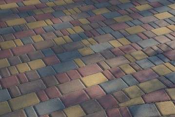 stone texture from the sidewalk with colored tiles
