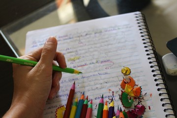 hand writing on a notebook