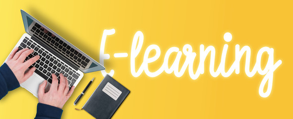 e-learning and online education concept, top view of person using laptop computer on colorful...
