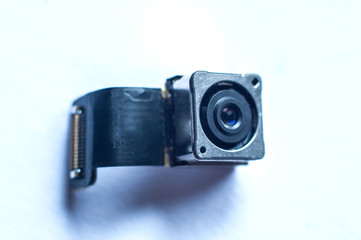Small camera for spying on people with a connection cable, close-up, macro shot.