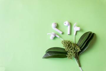 White wired headphones. Technology concept with copy space.
