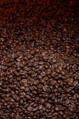 Coffee beans everywhere with a red background light 