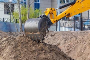 Excavator loader during earthworks at a construction site. The excavator is on the construction of...