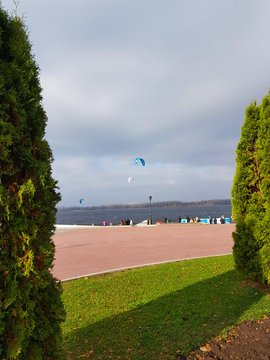 Observation of paragliding competitions on the embankment.
