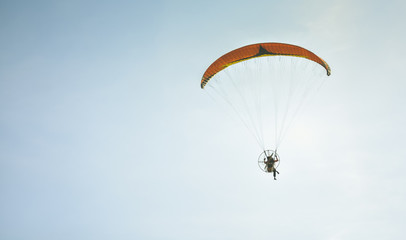 paragliding in the blue sky