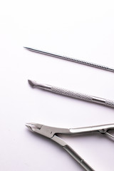 Manicure and pedicure tools on a white background