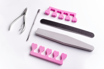 Manicure and pedicure tools on a white background