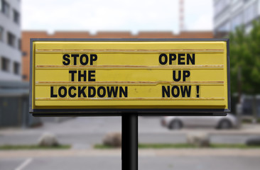 Billboard saying Stop the Lockdown - Open Up Now! Anti-lockdown protests due to Coronavirus...