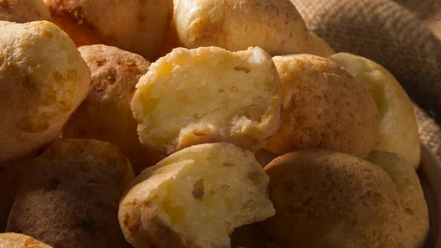Slide shot Cheese bread. Traditional brazilian food with smoke.