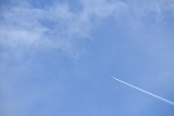 Airliner flying in cloudy sky