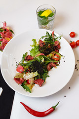 Roast beef with salad mix. Mix of salads, cherry tomatoes, baked pepper, sun-dried tomatoes, roast beef, mustard sauce