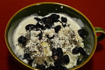 cottage cheese and sour cream with dried fruits and sesame seeds