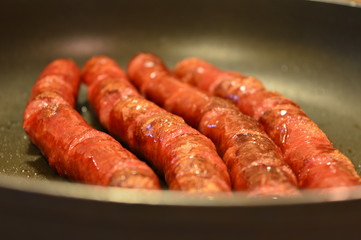 sausages on a grill
