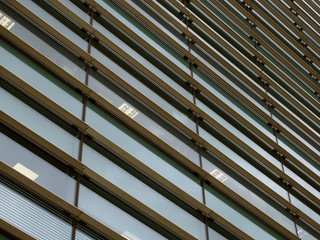 a full frame modern office architecture abstract with geometric shapes and buildings reflected in blue glass windows