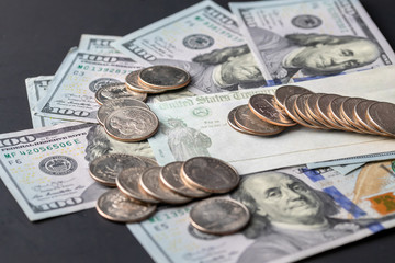 United States Treasury check issued for Economic Impact Payment or IRS Tax Refund with US Currency Illustrative editorial COVID-19 Pandemic stimulus check or economic stimulus bill. 