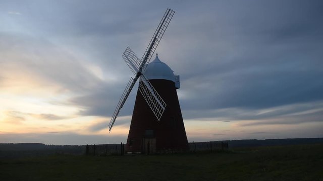 Beautiful sunset behind Halnaker windmill near Chichester in West Sussex, the mill is grade 2 listed and dates from the mid 18th century recently restored in 2018.