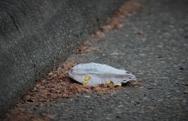 Coronavirus N95 masks litter the empty streets and environment during global pandemic.