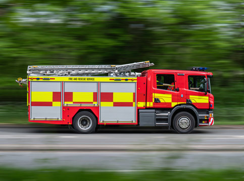 Fire Engine Driving Along Road