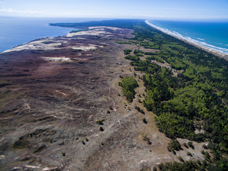 Aerial view with dunes, forest and sea in Curonian spit on a sunny day photographed with a drone. The Curonian Spit lagoon. Gray Dunes, Dead Dunes. 