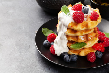 Delicious belgian waffles with summer berries