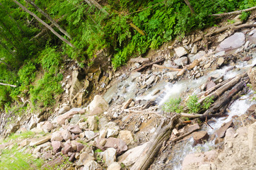 Mountain waterfall with rocks and moss