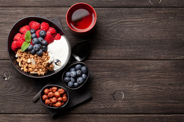 Healthy breakfast with granola, yogurt and berries