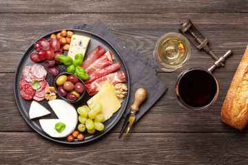 Cheese, meat, grapes and olives antipasto